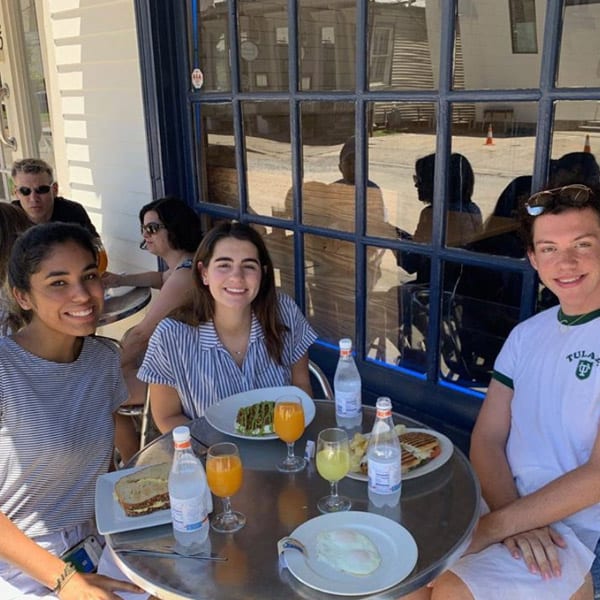 Guests enjoying brunch on the patio at Pepperoni Cafe